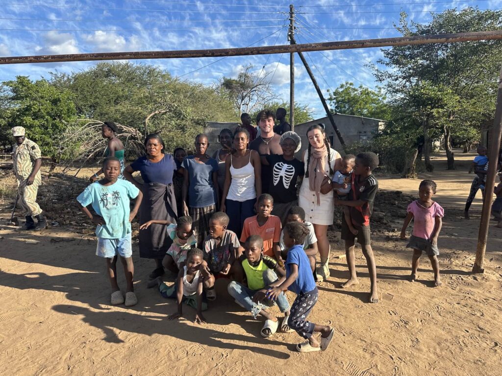 Visitors in Zambia meeting local children.