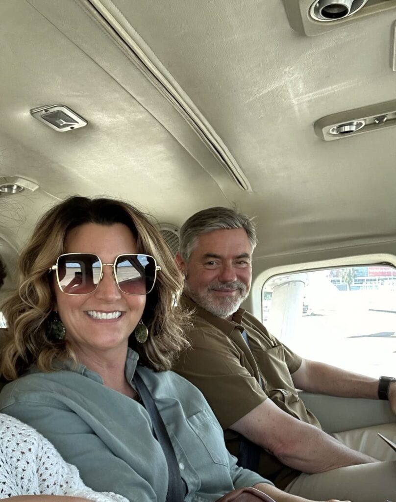 A man an women on a bush plane. 
