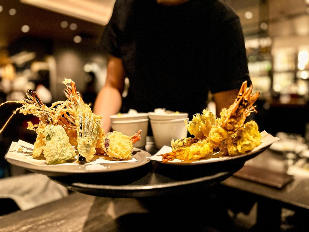 A man serving tempura in Japan. 